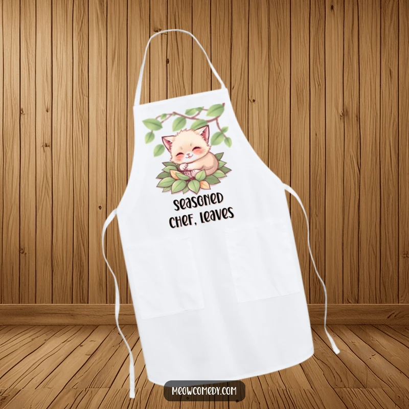 Funny Cat Apron: A tiny cat happily rolling in a pile of leaves, ready to add autumnal flair to your cooking.