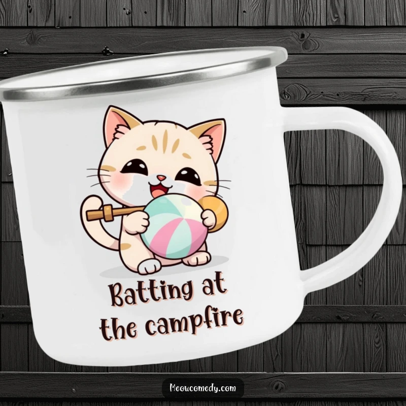 Funny camping mug with a kawaii cat delightedly batting a colorful ball, perfect for cute outdoor moments.