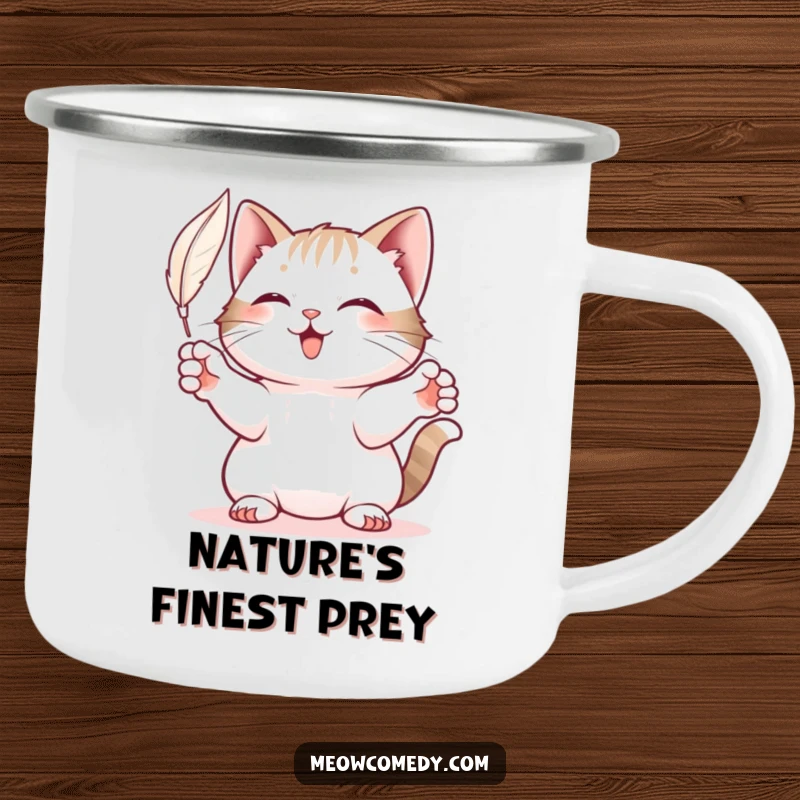 Funny Cat Camping Mug: A sturdy mug showing a cat playfully batting at a floating feather on a mountain.