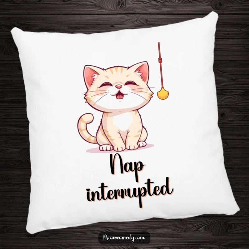 Funny cat pillow showing a cat comically batting at a dangling string toy with its paws, full of playful energy.