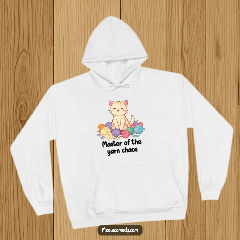 Funny kawaii cat snuggled in a huge pile of yarn, looking super pleased, warm and funny hoodie gift.