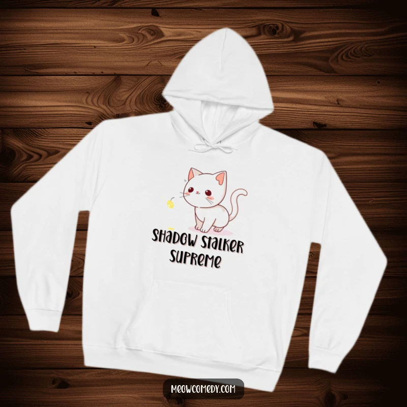 Funny Cat Hoodie: A cute cat tiptoeing through the darkness, intently focused on a mesmerizing, glowing firefly.