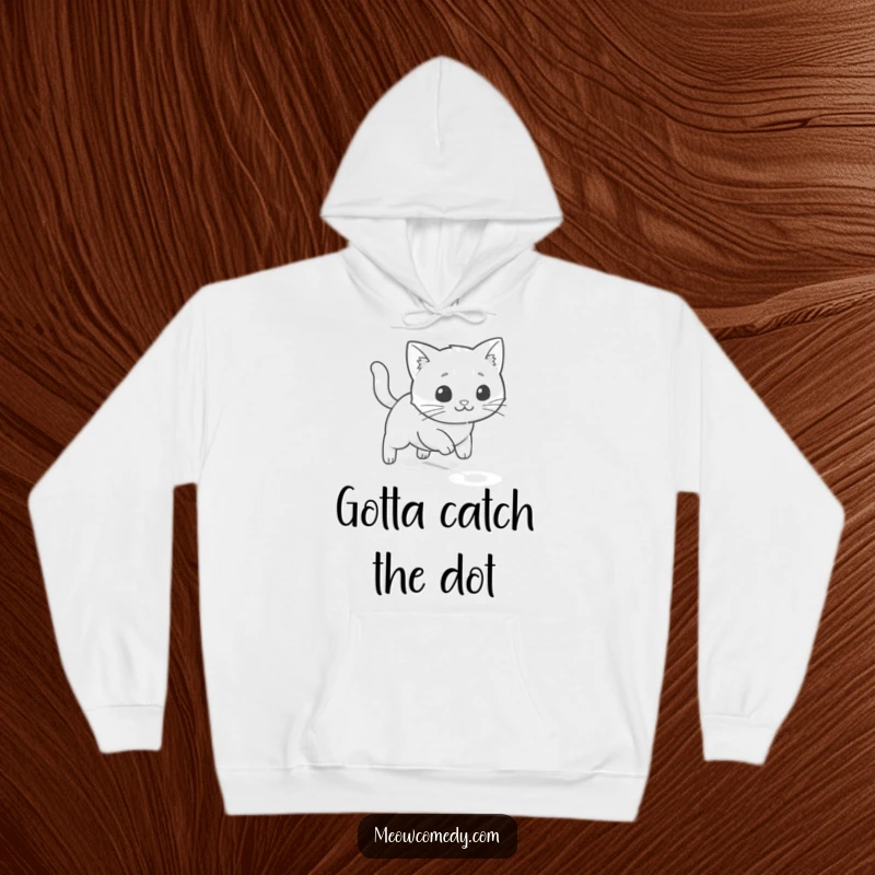 Funny kawaii cat intensely chasing a laser dot on the floor, comfortable and humorous hoodie for playful souls.