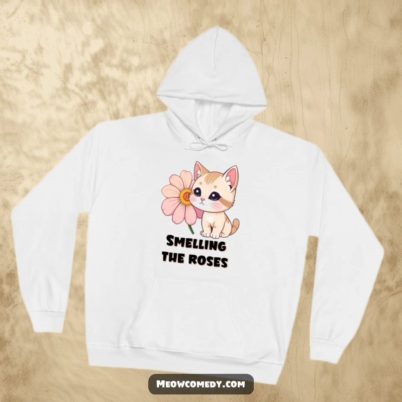 Funny Cat Hoodie featuring a curious cat gently sniffing a large, vividly colored flower.