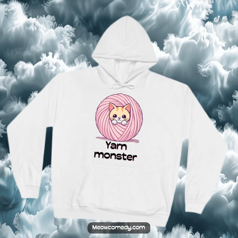 Funny cozy hoodie with a kawaii cat peeking from behind a giant ball of yarn, perfect for gifting.