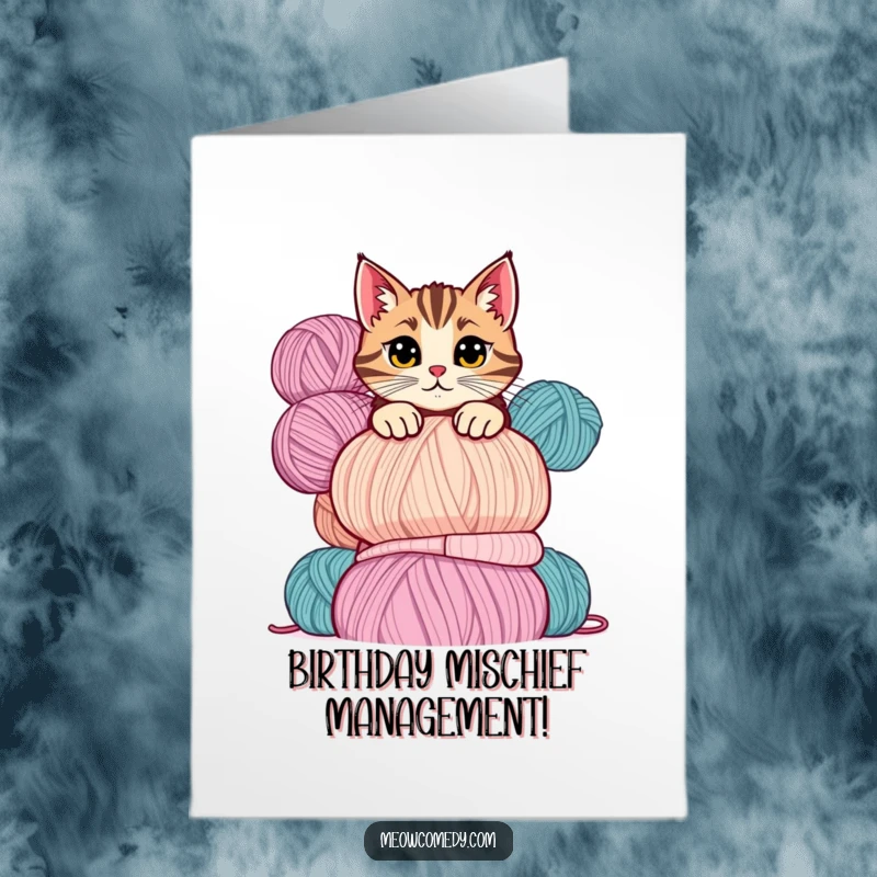 Funny Free Printable Birthday Card featuring a mischievous cat peeking curiously over a towering stack of colorful yarn balls.