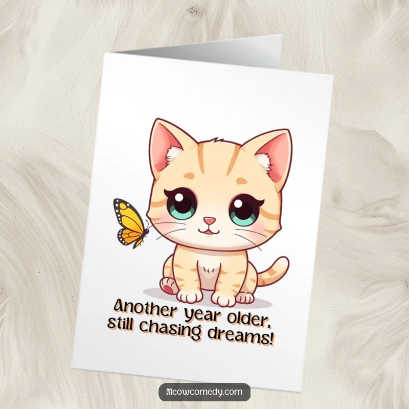 Funny Free Printable Birthday Card: A cute cat with huge, wide eyes fixated on chasing a fluttering butterfly. Playful and amusing.