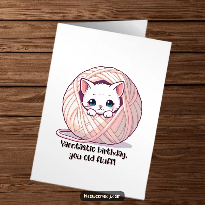 Funny Free Printable Birthday Card: Kawaii cat peeking from behind a huge ball of yarn, ready to pounce.