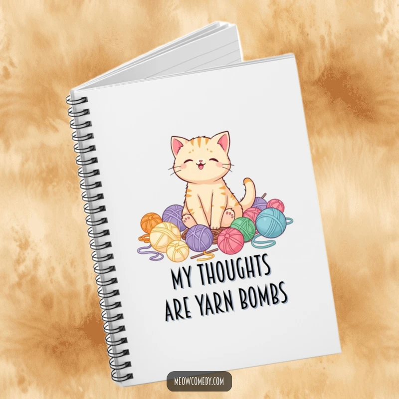 Funny kawaii cat looking pleased surrounded by yarn balls on a notebook cover, perfect for journaling gift.