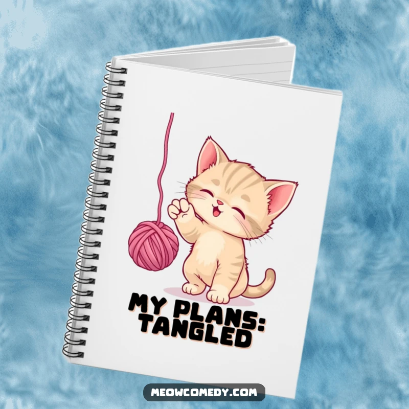 Funny Playful Kitten Notebook: A kitten batting at a ball of yarn is depicted on this amusing notebook for writing and notes.