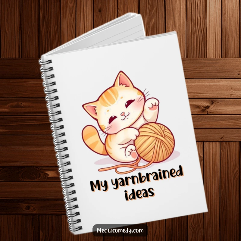 Funny cat yarn notebook, showcasing a playful cat tumbling with string, perfect for jotting down ideas with feline flair.