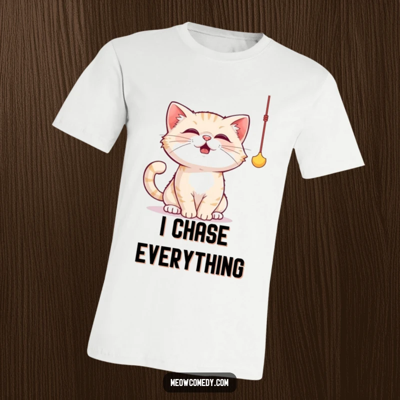 Funny cat t-shirt featuring a cute cat actively and playfully batting at a dangling string toy with focused determination.