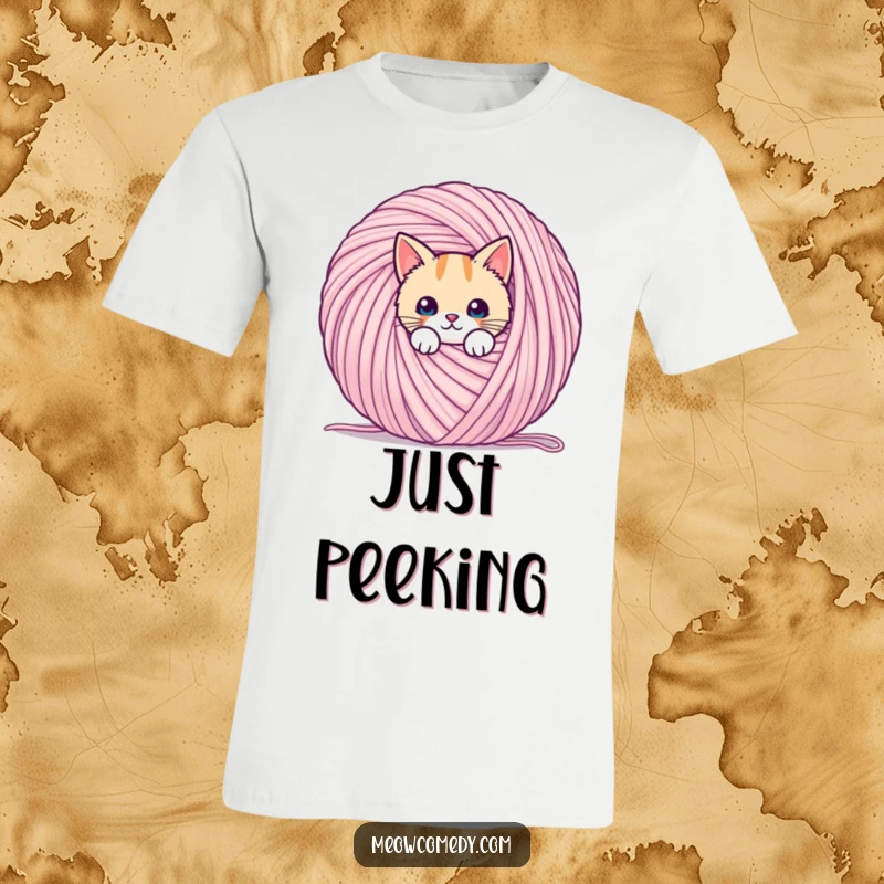 Funny kawaii cat, peeking from behind a giant ball of yarn, printed on a soft and comfortable t-shirt.