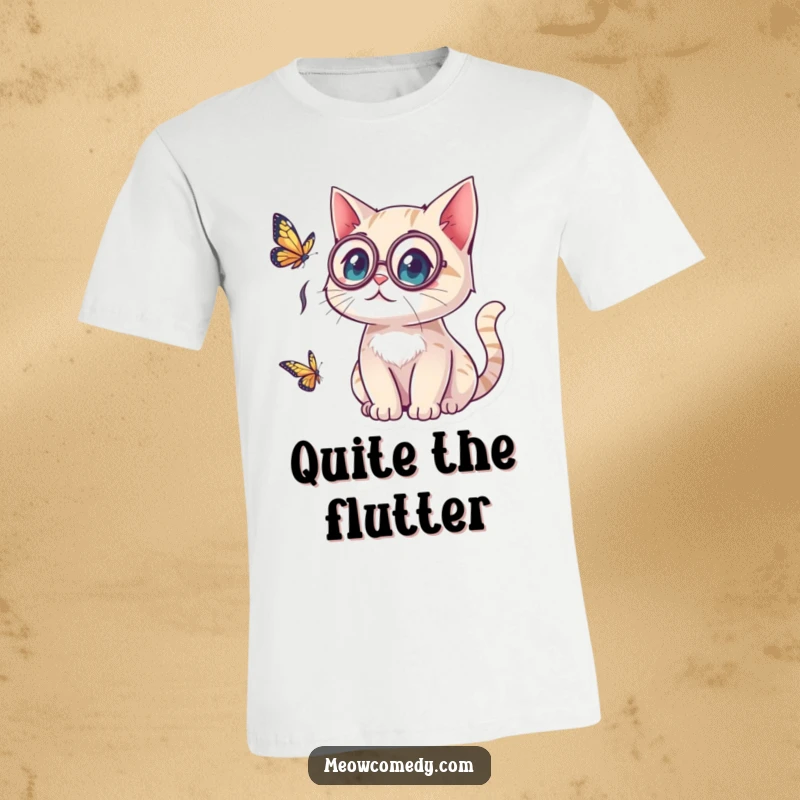 Funny kawaii cat wearing a monocle, looking surprised by a butterfly, a moment of delightful astonishment on a stylish t-shirt.