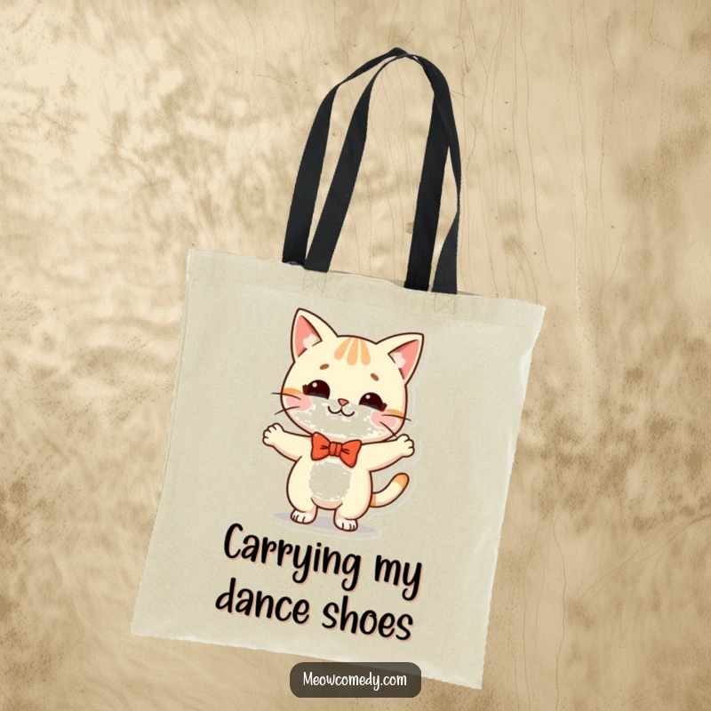 Funny Kawaii Cat Tote Bag: a cute cat with a bow tie, doing a silly dance, perfect for carrying essentials with flair.