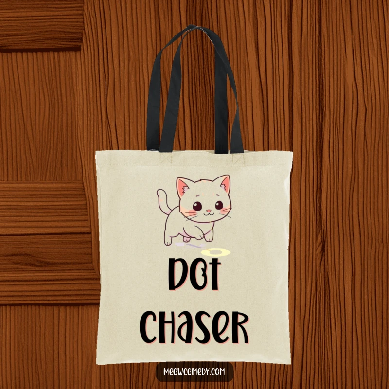 Funny kawaii cat playfully chasing a laser dot on the floor, cute and humorous tote bag for daily use.