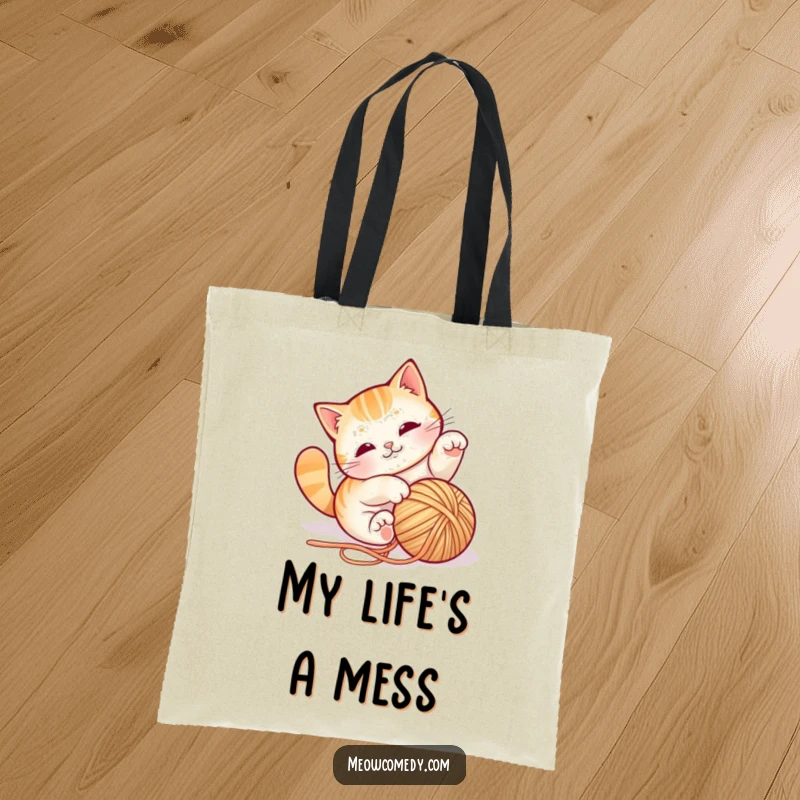 Funny cat yarn tote bag, depicted mid-tumble with a ball of string, practical and charming, carrying fun wherever you go.