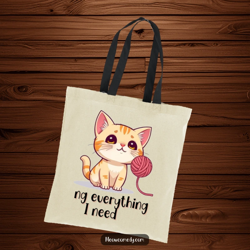 Funny Cat Tote Bag: A durable bag showing a cat with perked ears, mesmerized by a spinning ball of yarn.