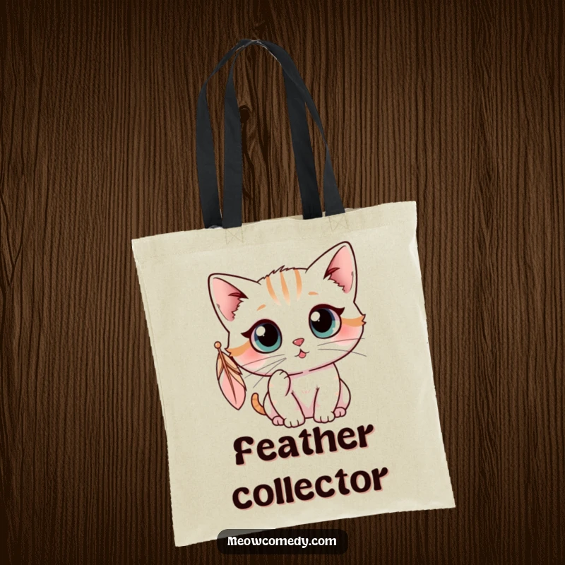 Funny kawaii cat with wide eyes batting at a dangling feather, cute and humorous tote bag.