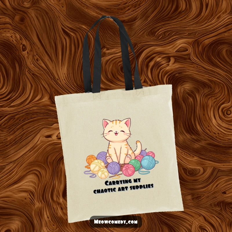 Funny kawaii cat looking pleased amidst scattered yarn balls, a cute and funny tote bag gift for shoppers.