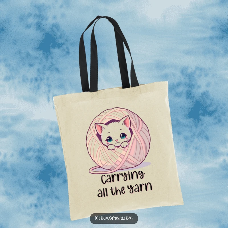 Funny kawaii cat peeking from behind a gigantic ball of yarn, a cute and humorous tote bag for daily use.
