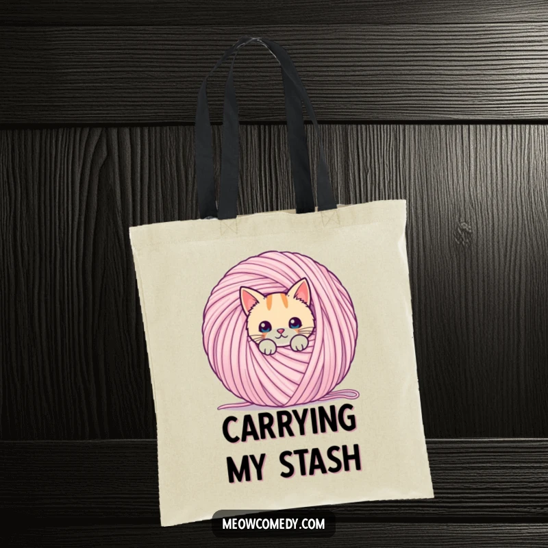 Funny kawaii cat, peeking from behind a giant ball of yarn, on a durable and stylish tote bag.